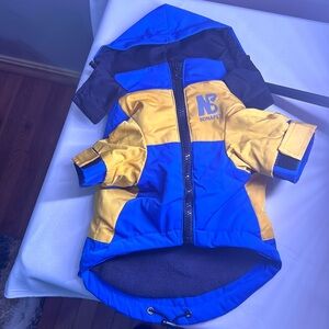 Blue and yellow waterproof jacket. Med.- Chest: 20.5" Length: 11”, Neck: 14.5"